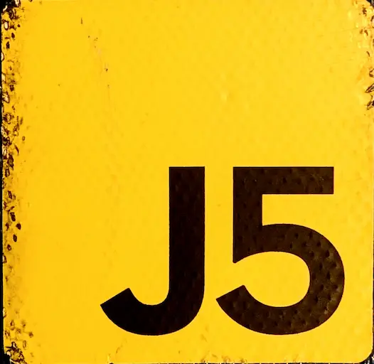 Sticker of yellow square with J5 like the Javascript logo referencing the Johnny Five project